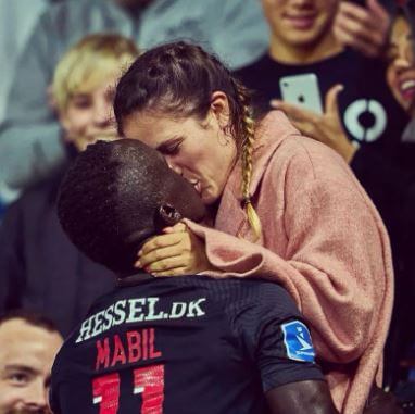 Awer Mabil with his girlfriend Camilla Duelund during the game.
